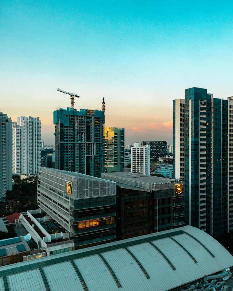 City high-rises at dusk with a warm sky